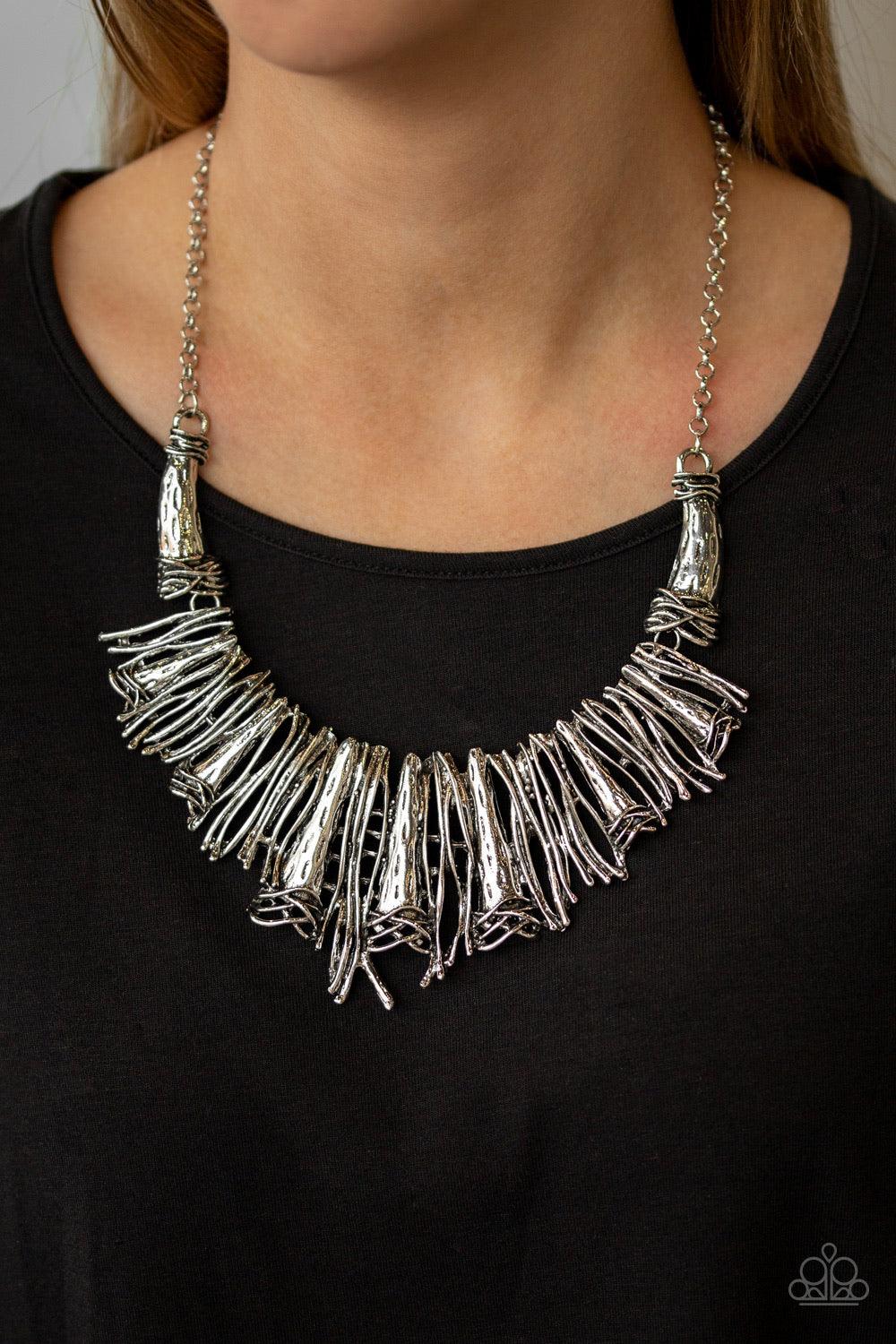 Paparazzi Accessories In the MANE-Stream - Silver Brushed in an antiqued shimmer, a collision of glistening silver bars and hammered silver accents coalesce into an abstract statement piece below the collar for a fierce industrial look. Features an adjust