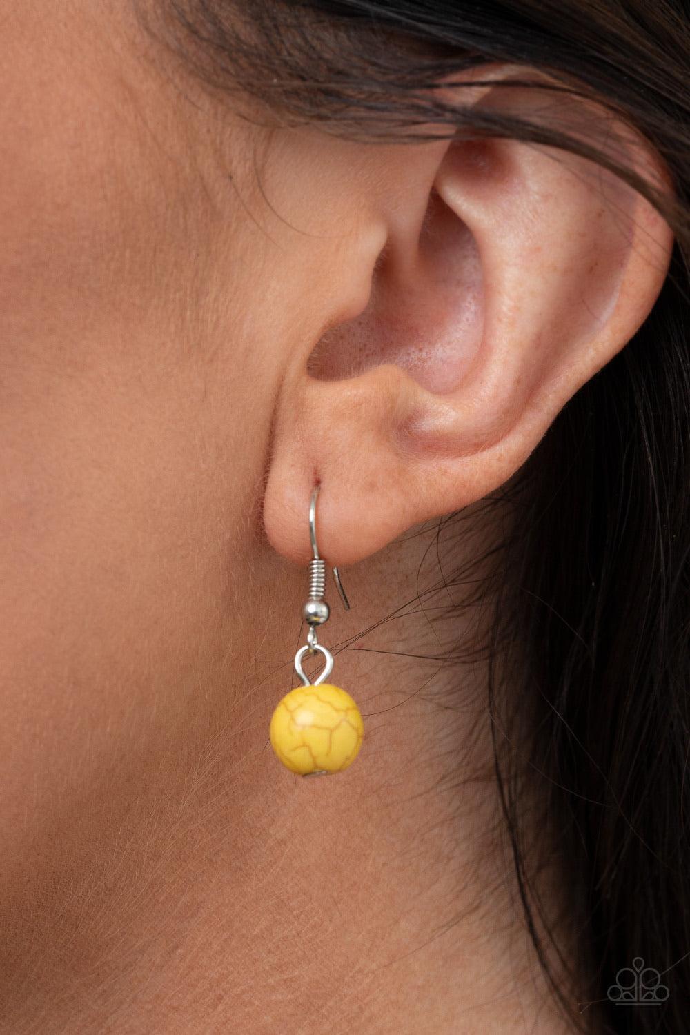 Paparazzi Accessories Bountiful Badlands - Yellow Layers of lifelike silver petals bloom from sunny yellow centers as they link below the collar for a seasonal statement-making look. The floral frames gradually increase in size as they inch towards the ce