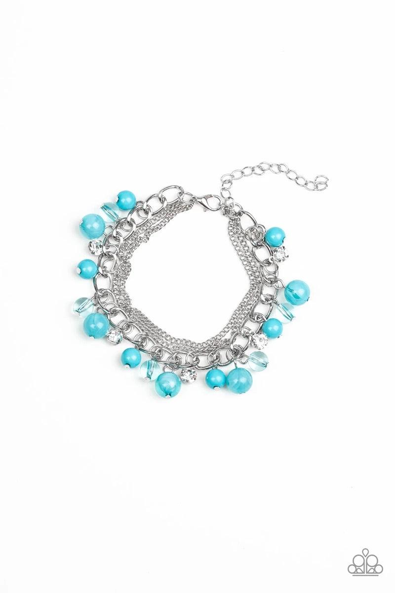 Paparazzi Accessories Let me Sea - Blue Infused with layers of mismatched silver chains, glassy, polished blue, and glittery white rhinestones swing from the wrist in a whimsical fashion. Features an adjustable clasp closure. Sold as one individual bracel
