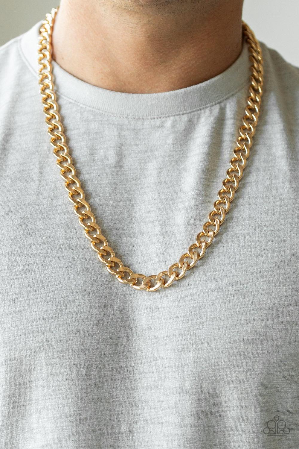 Paparazzi Accessories Alpha - Gold Featuring classic curb chain, a thick gold chain drapes across the chest for a sleek, upscale look. Features an adjustable clasp closure. Jewelry