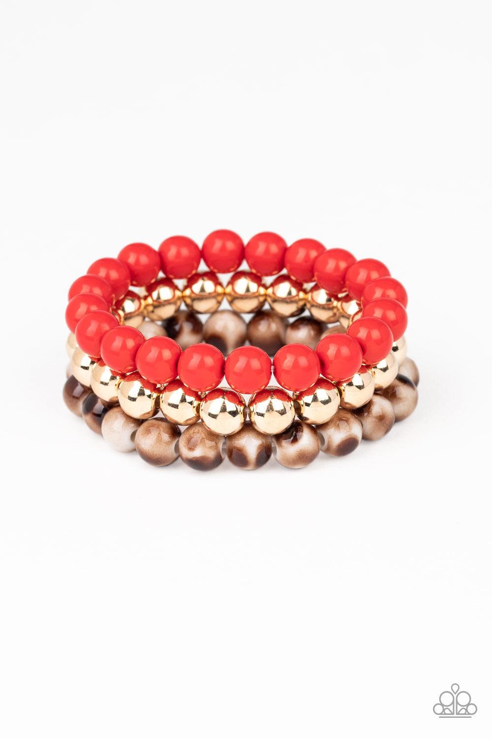 Paparazzi Accessories Courageously Couture - Red Strands of red, gold, and brown tortoise-like beads are threaded along stretchy bands around the wrist, creating colorful layers. Jewelry