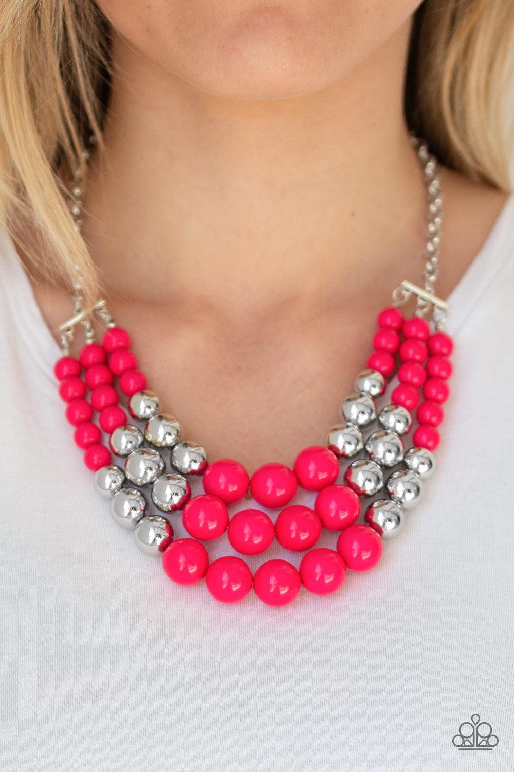 Paparazzi Accessories Dream Pop - Pink Gradually increasing in size near the center, a collection of pink and silver beads layer below the collar in a statement making fashion. Features an adjustable clasp closure. Jewelry