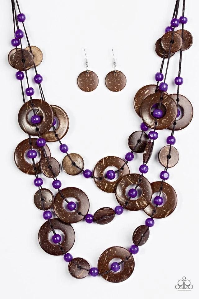 Paparazzi Accessories Bahama Bungalow - Purple Brushed in a distressed finish, wooden discs link into three summery rows below the collar. Round purple beads are knotted between the wooden accents, adding colorful accents to the seasonal palette. Features