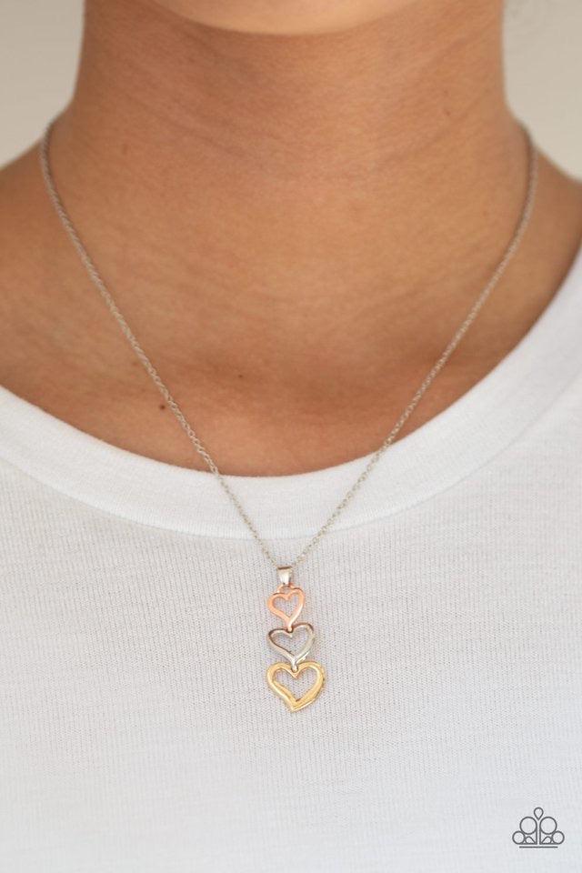 Paparazzi Accessories Hearts Aflutter - Multi Gradually increasing in size, shiny copper, silver, and gold heart frames connect into a flirty pendant below the collar. Features an adjustable clasp closure. Sold as one individual necklace. Includes one pai