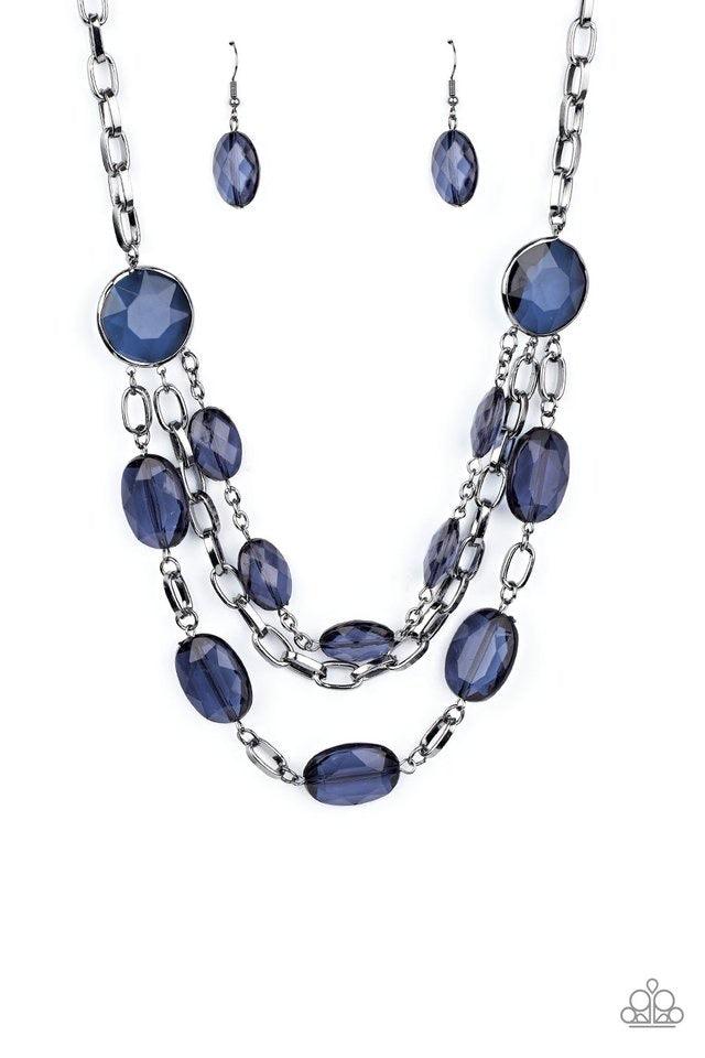 Paparazzi Accessories I Need a GLOW-cation ~Blue Strung between two matching Blue Depths gem-like fittings, two glittery rows of Blue Depths oval gems flank a strand of bold gunmetal chain below the collar for a flawlessly layered look. Features an adjust