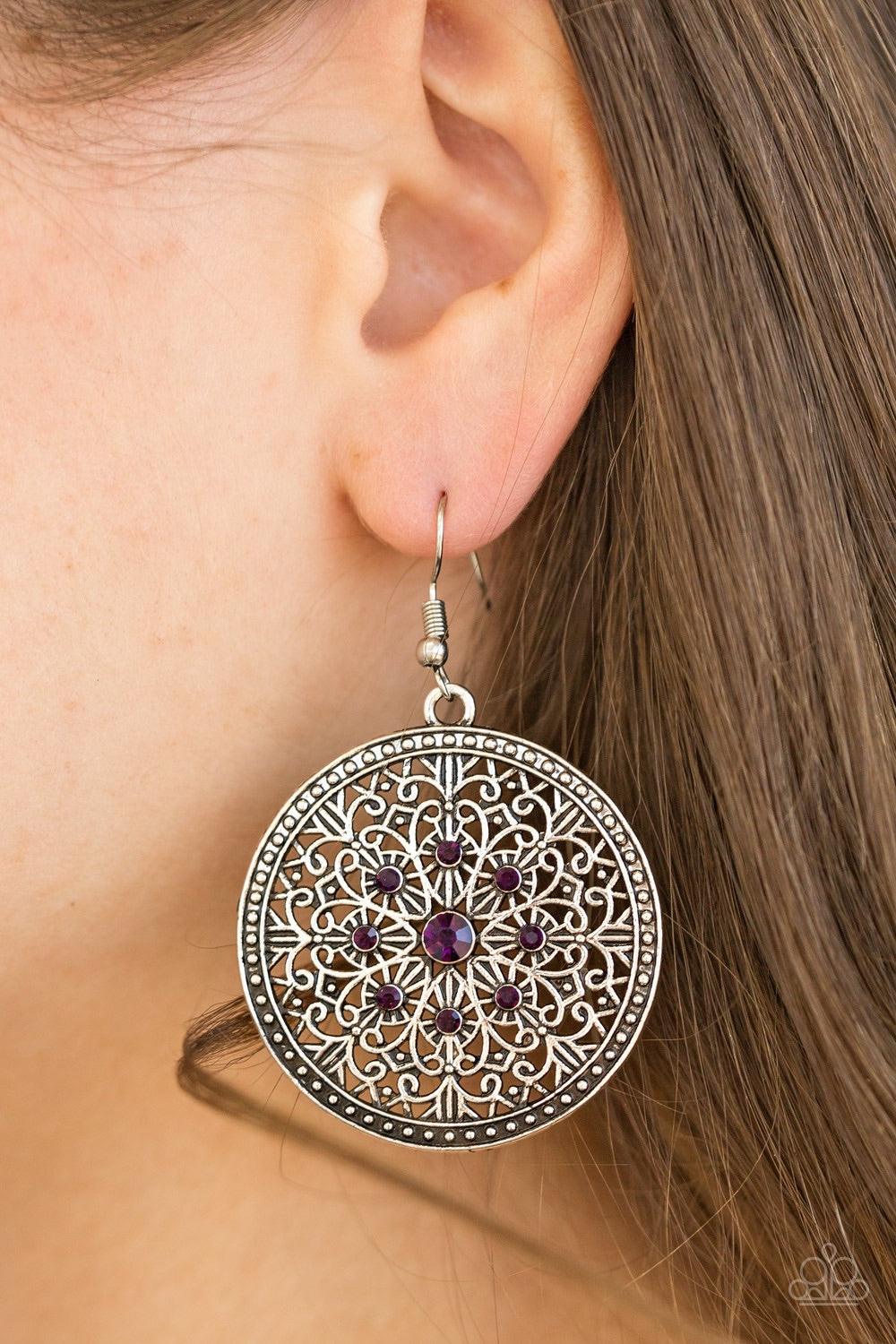 Paparazzi Accessories Catch A Chill - Purple Shimmery silver filigree swirls into an ornate snowflake pattern. Glittery purple rhinestones are pressed into the ornate center for a regal finish. Earring attaches to a standard fishhook fitting. Jewelry