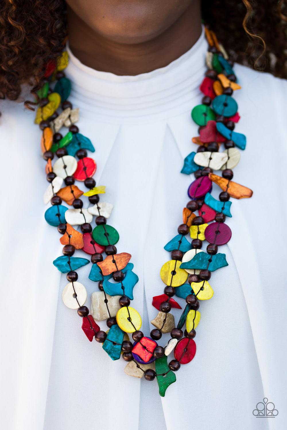 Paparazzi Accessories Living The Tropical Life - Multi Tinted in bright hues, bits of colorful wooden beads and discs join earthy wooden beads along an elongated strand of thread. Try double-wrapping or even triple-wrapping around the neck for a colorfull