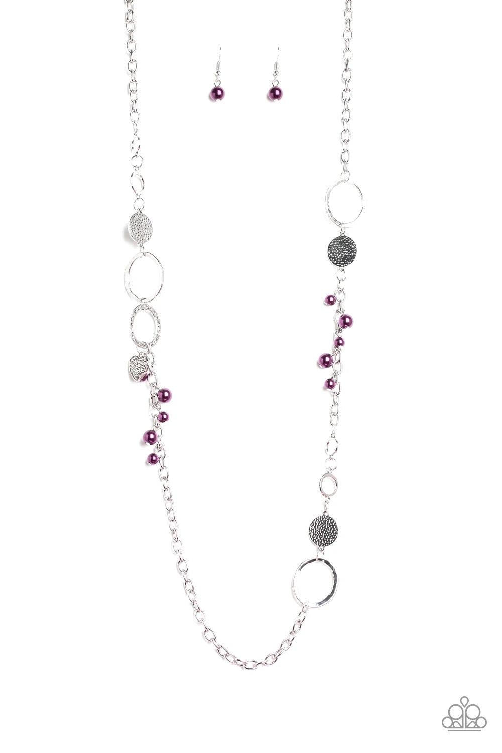 Paparazzi Accessories Unapologetic Flirt - Purple Infused with sections of shimmery silver chains, an assortment of hammered silver discs and silver rings link across the chest. A collection of pearly purple beads and dainty silver heart charms asymmetric