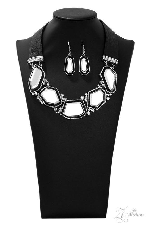 Paparazzi Accessories Rivalry 💗ZiCollection $25💗 Two thick strips of black leather give way to a blinding collection of glassy geometric gems, creating a mirror-like fringe below the collar. Varying in shape, the blinding gems are pressed into hammered