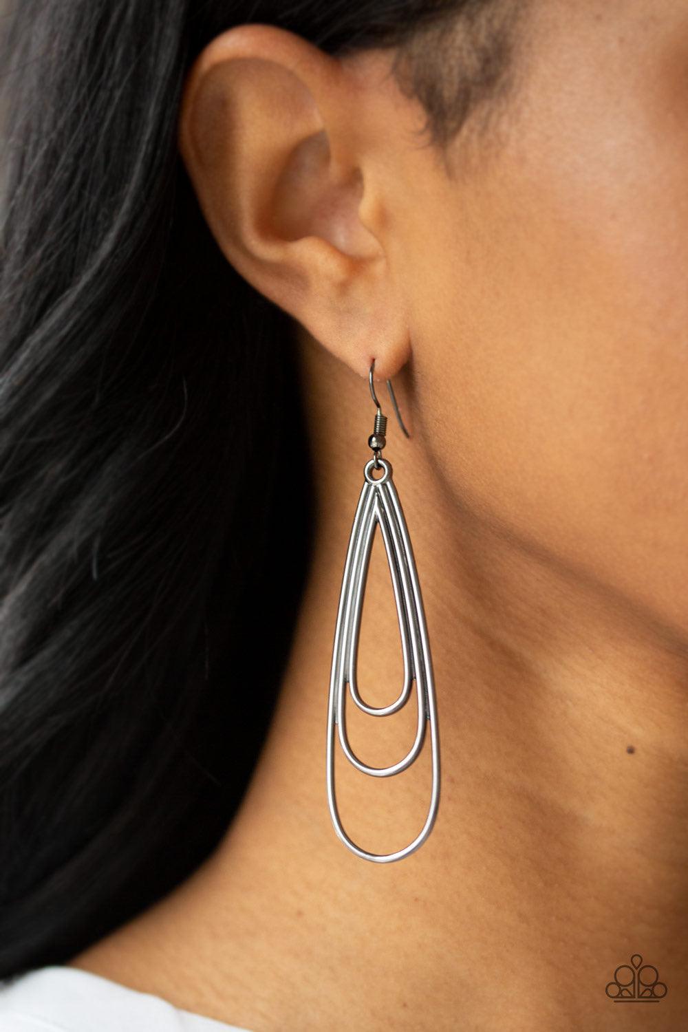 Paparazzi Accessories Triple Ripple ~Black Gradually increasing in size, glistening gunmetal teardrops coalesce into a rippling frame for an edgy look. Earring attaches to a standard fishhook fitting.