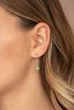Paparazzi Accessories Fashion Flaunt - Green Encrusted in rows of glassy white rhinestones, an imperfect silver teardrop frame is encrusted in a glowing green cat's eye stone. The ethereal pendant swings from the bottom of a lengthened silver chain dotted