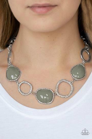 Paparazzi Accessories Haute Heirloom - Silver Delicately hammered in shimmery textures, asymmetrical silver rings and silver beaded frames link below the collar for a colorful look. Features an adjustable clasp closure. Jewelry