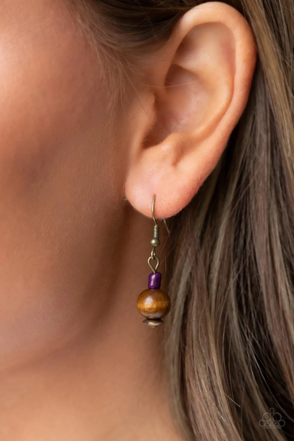 Paparazzi Accessories Knotted Keepsake - Purple An earthy assortment of purple and plum seed beads, rustic brass discs, and wooden accents glide along lengthy strands of gray cording that knot around a hammered brass disc. Tassels of matching beads, a whi