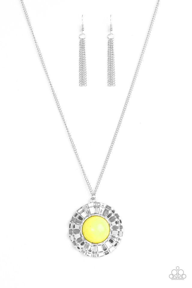 Paparazzi Accessories My Primary Color - Yellow Swinging from the bottom of an elongated silver chain, a dramatic yellow bead is pressed into the center of a scalloped silver frame, creating a bold pendant. Features an adjustable clasp closure. Jewelry