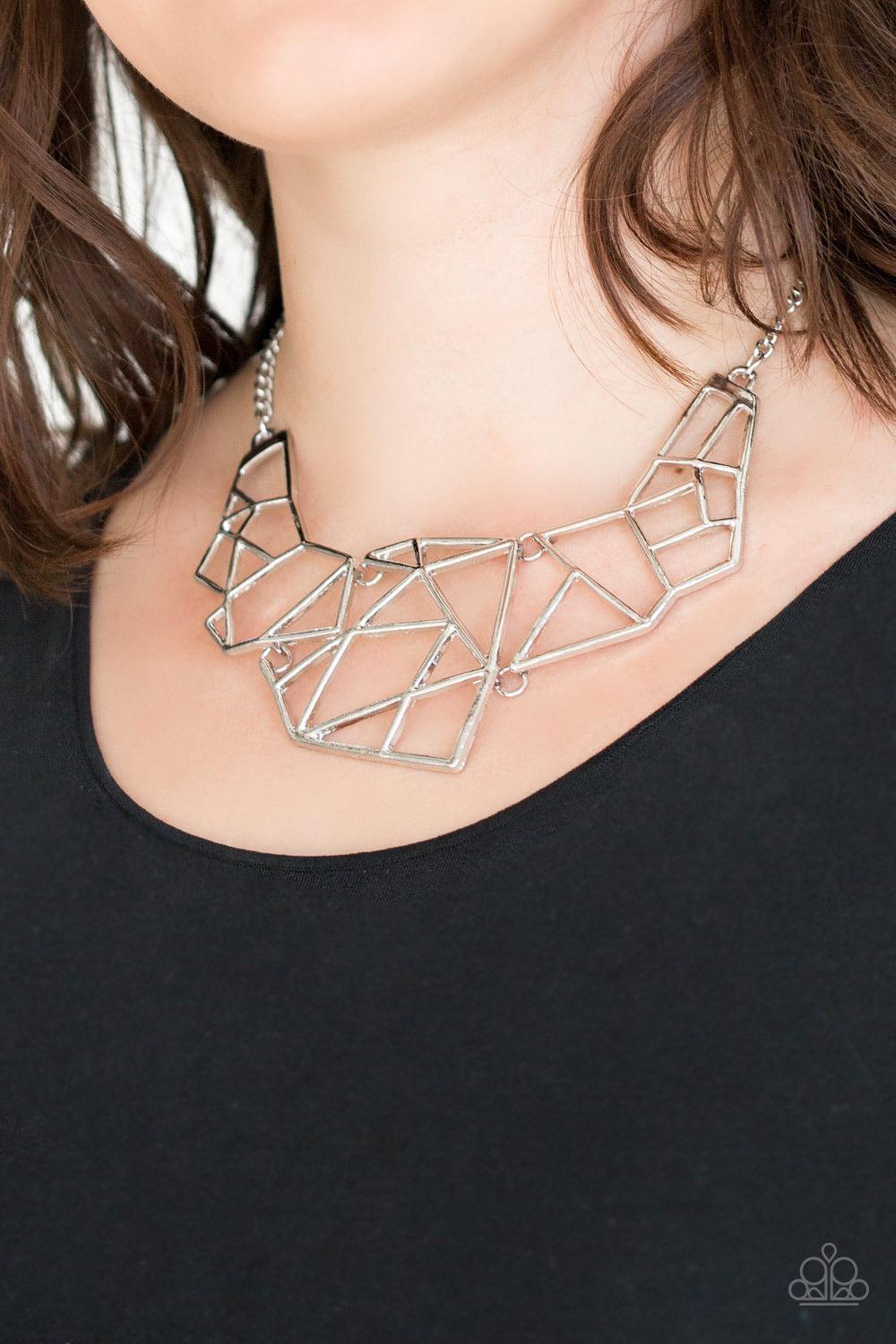 Paparazzi Accessories World Shattering ~Silver Shattered silver plates link below the collar, coalescing into an edgy geometric pendant. Features an adjustable clasp closure. Sold as one individual necklace. Includes one pair of matching earrings.