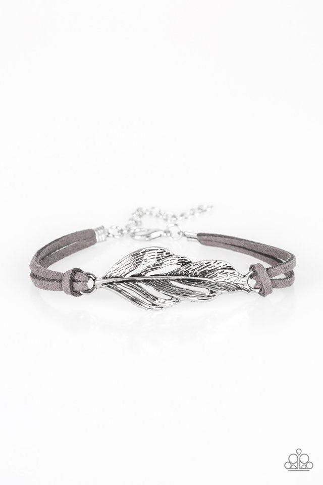 Paparazzi Accessories Faster Than FLIGHT - Silver Strands of gray suede knot around a shimmery silver feather charm, creating a seasonal pendant atop the wrist. Features an adjustable clasp closure. Jewelry