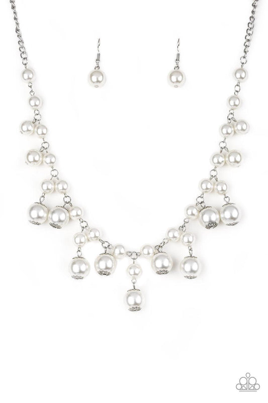 Paparazzi Accessories Soon To Be Mrs. - White Varying in size, bubbly white pearls swing from the bottom of a classic strand of pearls, creating a refined fringe below the collar. Features an adjustable clasp closure. Jewelry