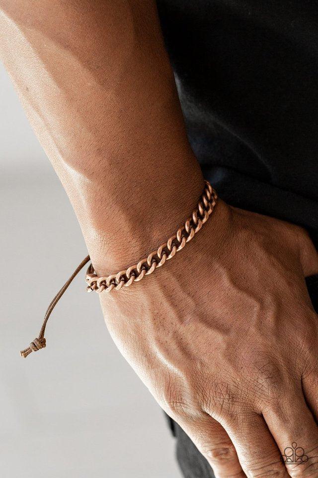 Paparazzi Accessories Tiebreaker - Copper Shiny brown cording knots around the ends of a dainty copper beveled cable chain that is wrapped across the top of the wrist for a versatile look. Features an adjustable sliding knot closure. Sold as one individua