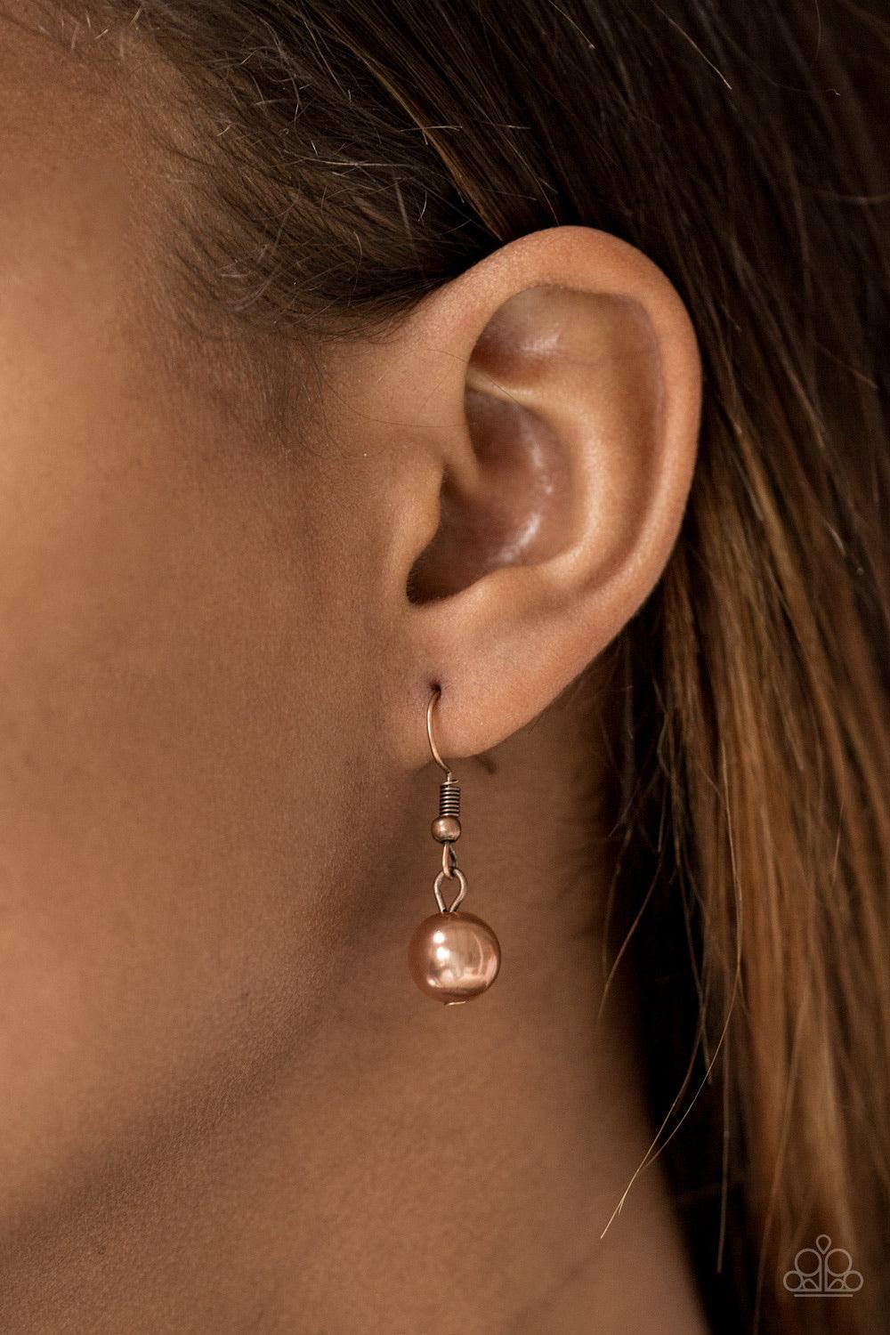 Paparazzi Accessories STUN Control - Copper Pearly copper beads trickle along strands of glistening copper chains, creating a tapered fringe below the collar. Features an adjustable clasp closure. Sold as one individual necklace. Includes one pair of matc