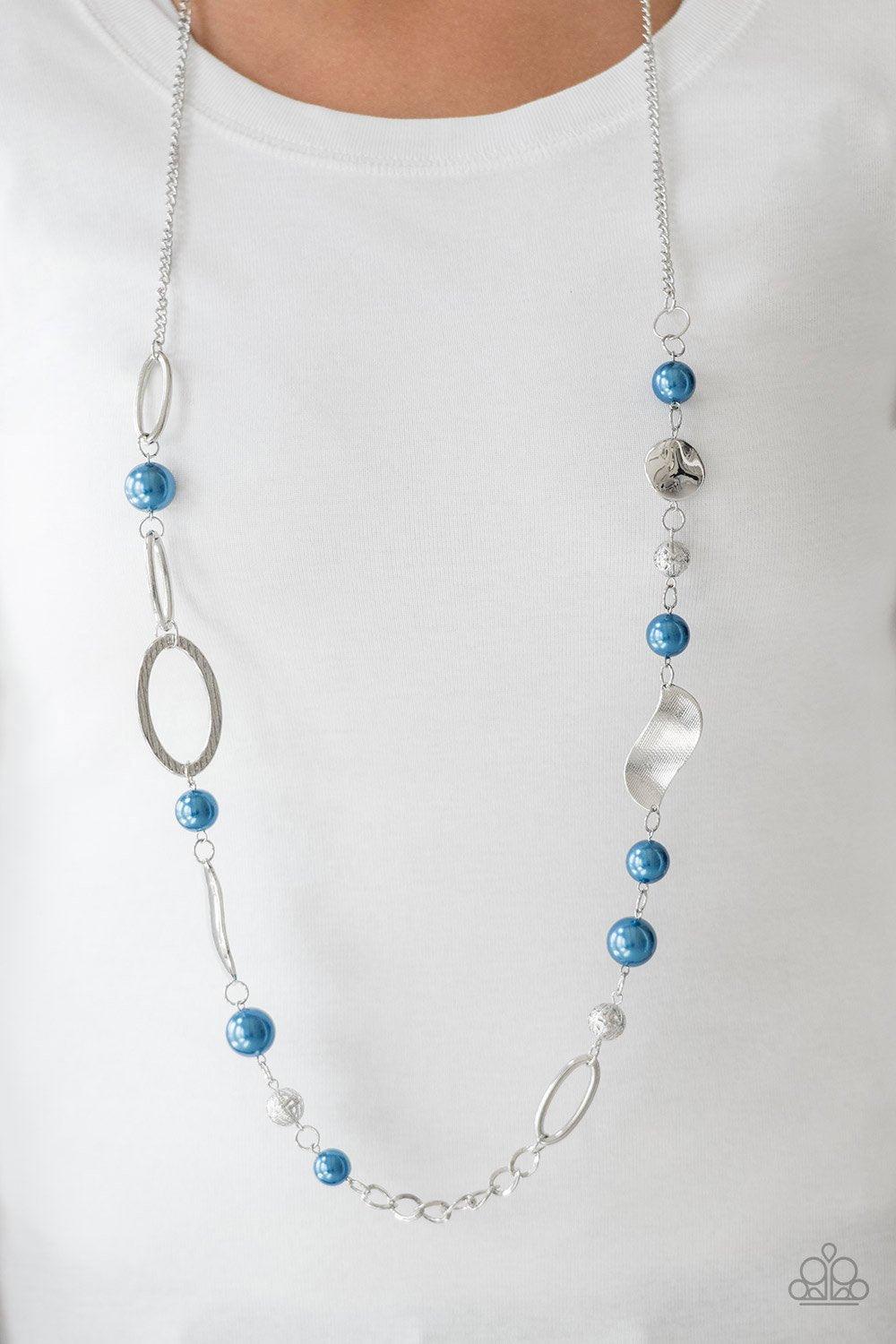 Paparazzi Accessories All About Me - Blue Oversized blue pearls, ornate silver beads, and an array of glistening silver accents trickle along a lengthened silver chain for a refined look. Features an adjustable clasp closure. Jewelry