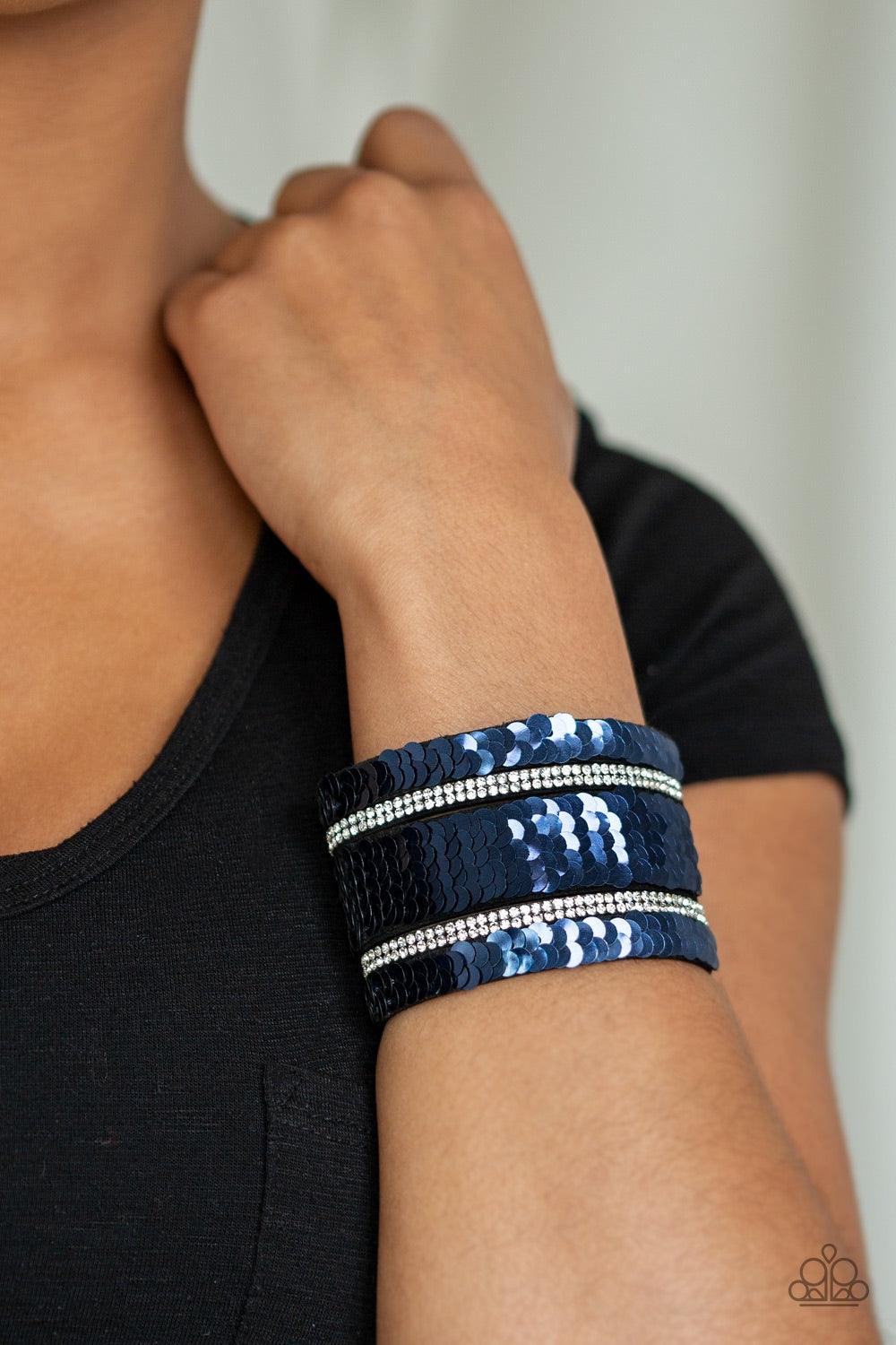 Paparazzi Accessories MERMAID Service - Blue Infused with strands of blinding white rhinestones, row after row of shimmery sequins are stitched across the front of a spliced black suede band. Bracelet features reversible sequins that change from silver to