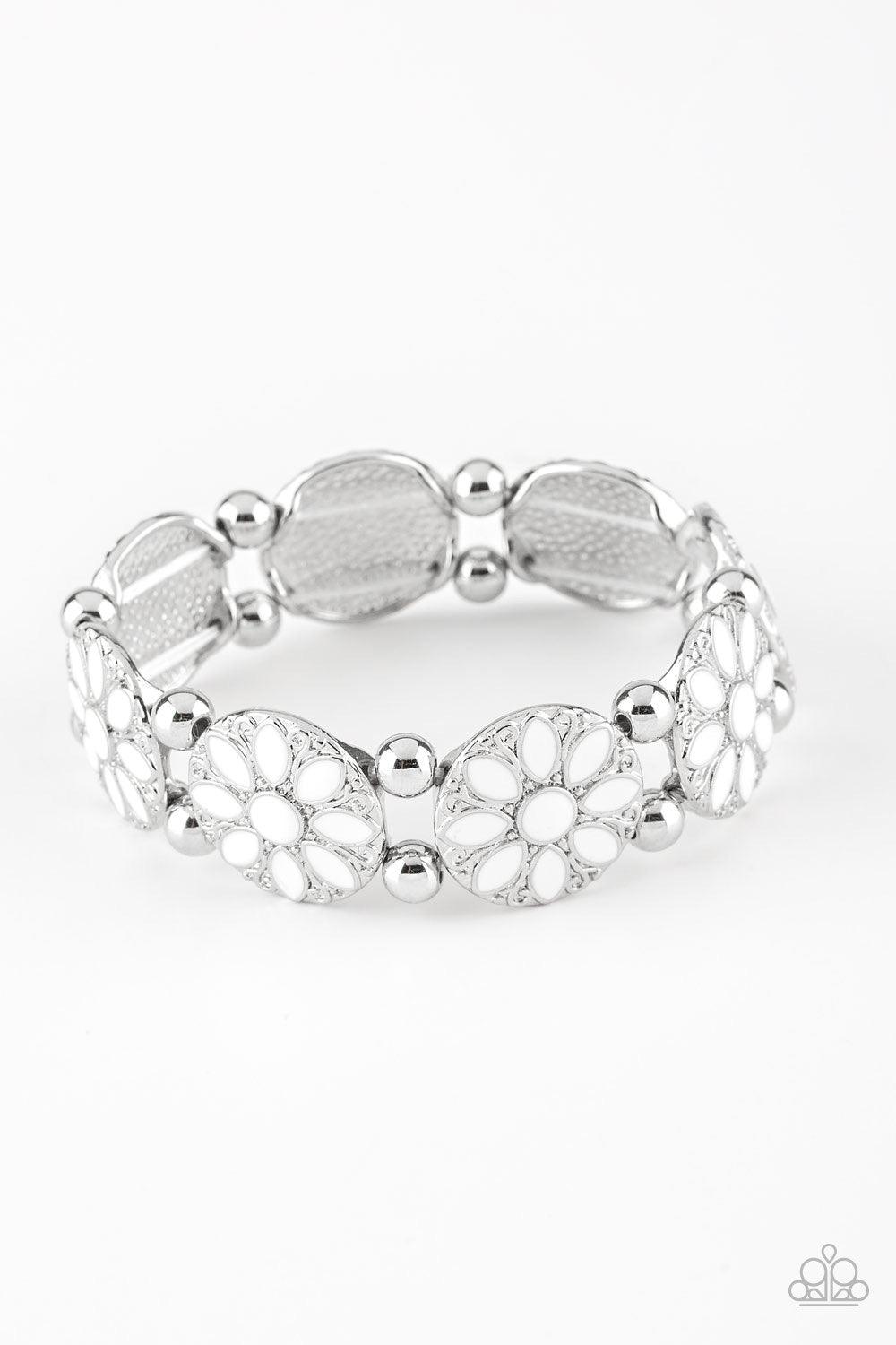 Paparazzi Accessories Dancing Dahlias - White Painted in a refreshing white finish, ornate silver floral frames are threaded along a stretchy band across the wrist for a seasonal look. Sold as one individual bracelet. Jewelry