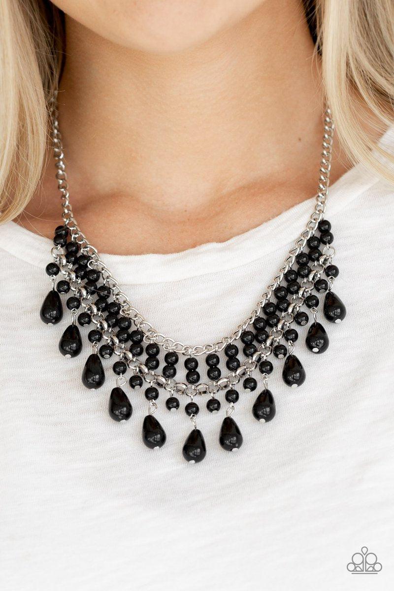 Paparazzi Accessories The Guest List - Black Threaded along metallic rods, pairs of black beads are stacked between two silver chains. Matching black beads and shiny black teardrops drip from the bottom, creating a refined fringe below the collar. Feature