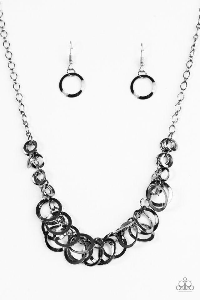 Paparazzi Accessories Royal Circus - Black Glistening gunmetal hoops swing from the bottom of a bold gunmetal chain, creating a flirty fringe below the collar. Features an adjustable clasp closure. Sold as one individual necklace. Includes one pair of mat