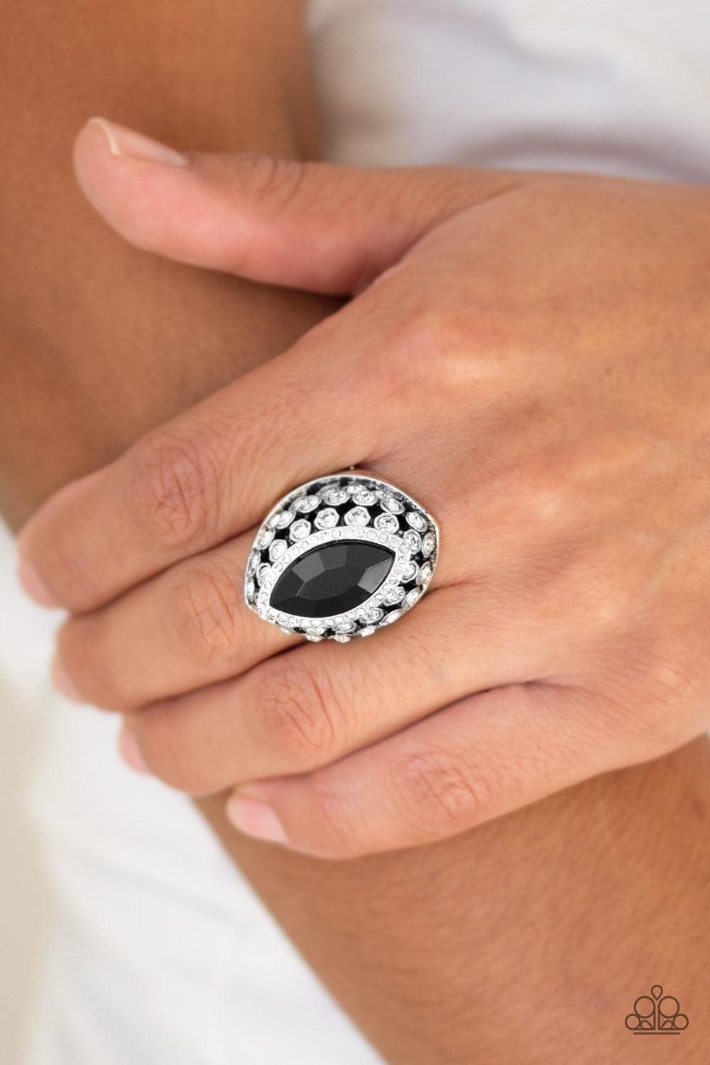 Paparazzi Accessories Royal Radiance - Black Featuring a regal marquise style cut, a sparkling black rhinestone is pressed into the center of a silver frame radiating with glittery white rhinestones for a blinding finish. Features a stretchy band for a fl