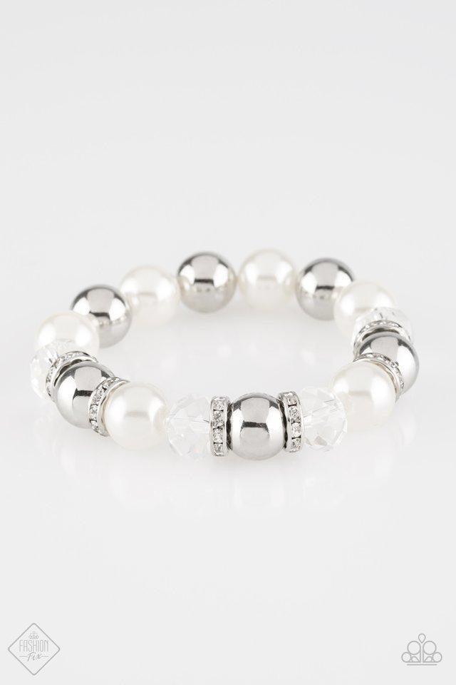 Paparazzi Accessories Camera Chic ~White Oversized silver, crystal-like, and pearly white beads are threaded along a stretchy elastic band and wrapped around the wrist for a glamorous look. White rhinestone encrusted rings are sprinkled between the dramat