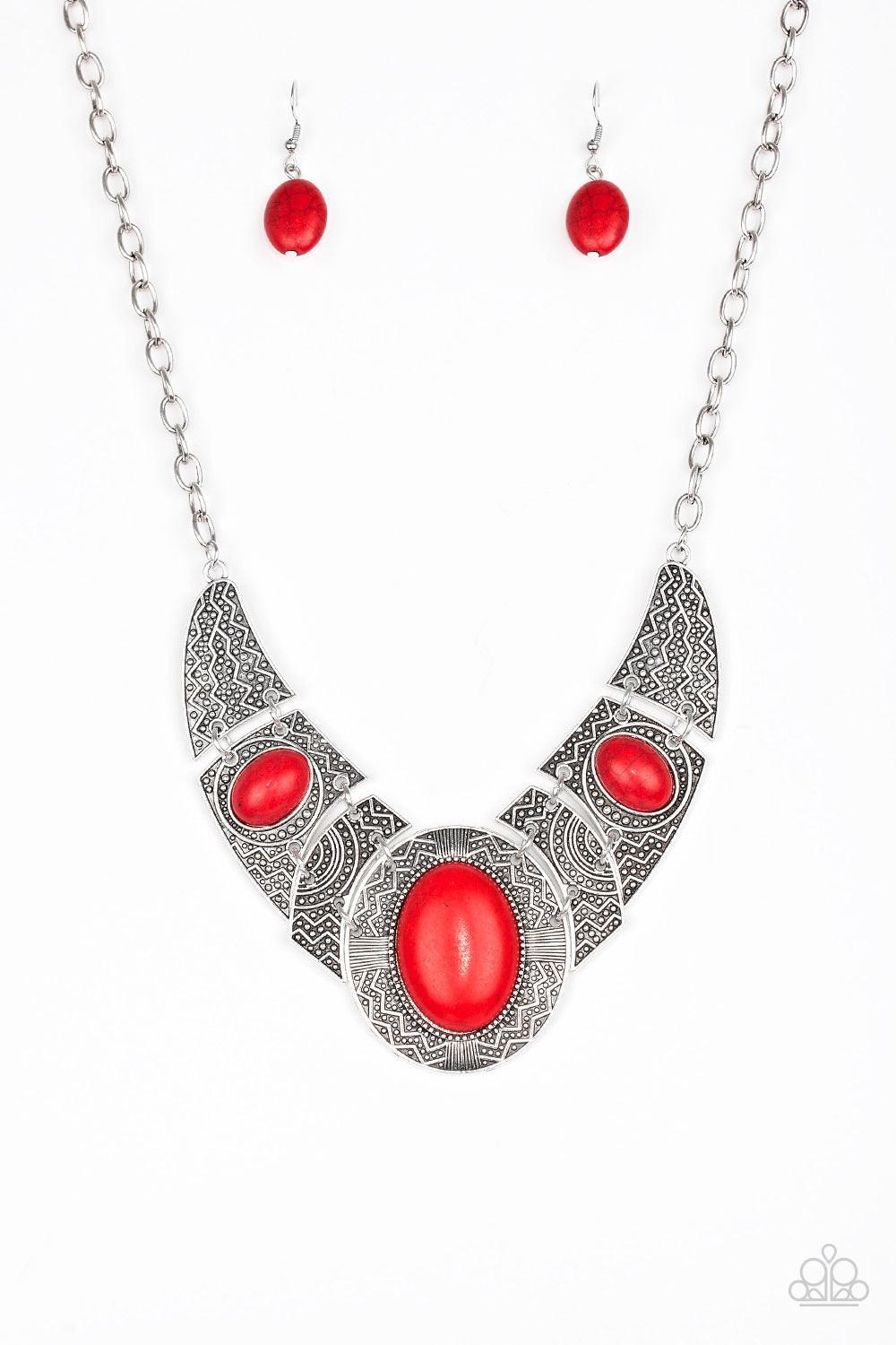 Paparazzi Accessories Leave Your LANDMARK - Red Radiating with studded and tribal inspired patterns, antiqued silver plates connect below the collar for a fierce look. Fiery red stones are pressed into the plates, adding an artisan flair to the dramatic c