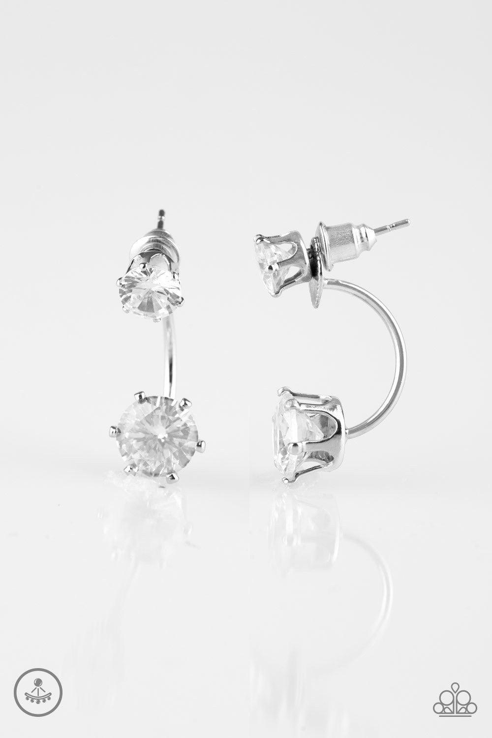 Paparazzi Accessories Starlet Squad - White A solitaire white rhinestone attaches to a double-sided post, designed to fasten behind the ear. Dotted with an oversized white rhinestone, the double-sided post peeks out beneath the ear for a dramatic look. Ea