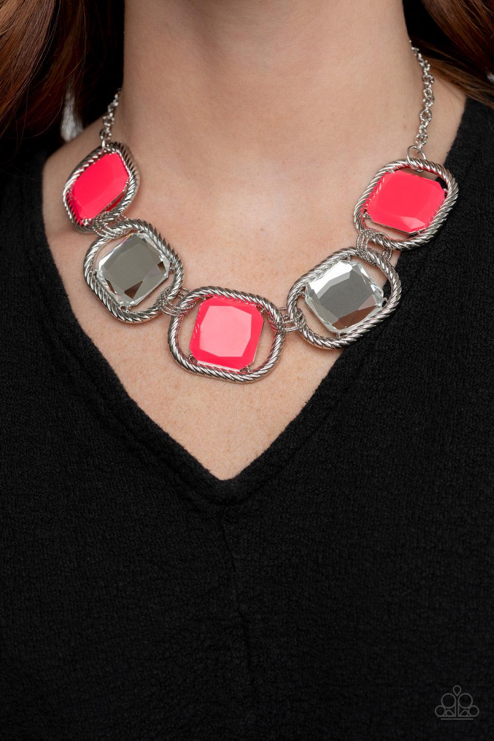 Paparazzi Accessories Pucker Up ~Pink Featuring regal cuts, faceted white gems and neon pink beads are pressed into the centers of rope-like silver frames that triple link below the collar for a dramatic pop of color. Features an adjustable clasp closure.