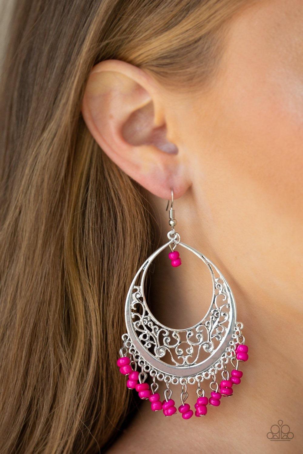 Paparazzi Accessories Malibu Mamba - Pink A stacked fringe of pink seed beads swing from the bottom of a shimmery silver hoop featuring a vine-like border for a whimsical look. Matching seed beads swing from the top of the frame for an eye-catching finish