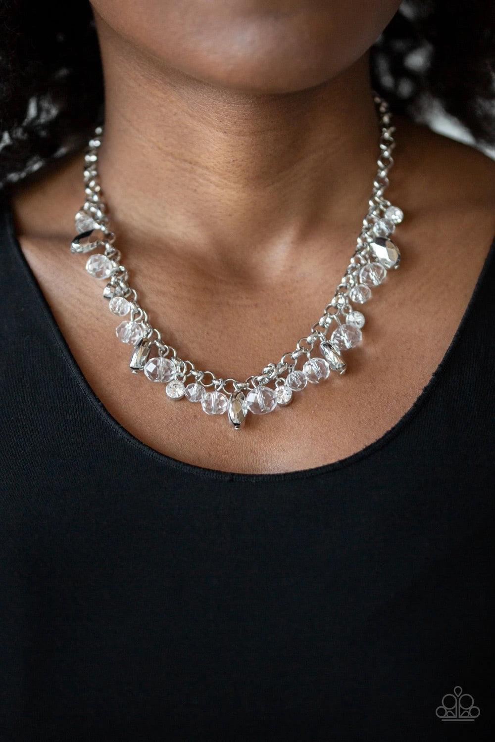 Paparazzi Accessories Downstage Dazzle - White A glittery collection of sparking white rhinestones, faceted silver beads, and glassy crystal-like beads dangle from a shimmery silver chain, creating a refined fringe below the collar. Features an adjustable