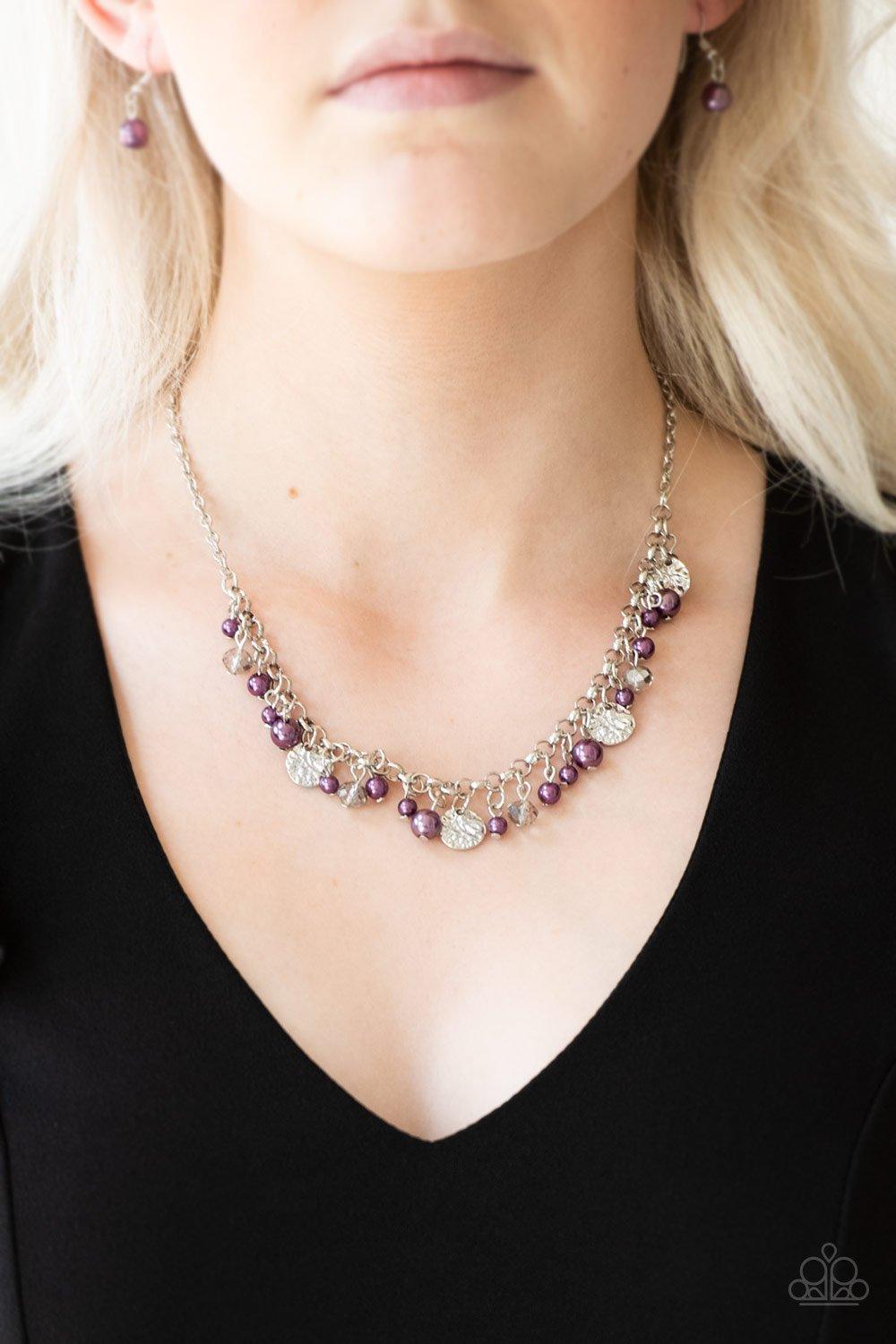 Paparazzi Accessories Coastal Cache - Purple Pearly purple beads, smoky crystal-like gems, and hammered silver discs swing from a bold silver chain, creating a refined fringe below the collar. Features an adjustable clasp closure. Sold as one individual n