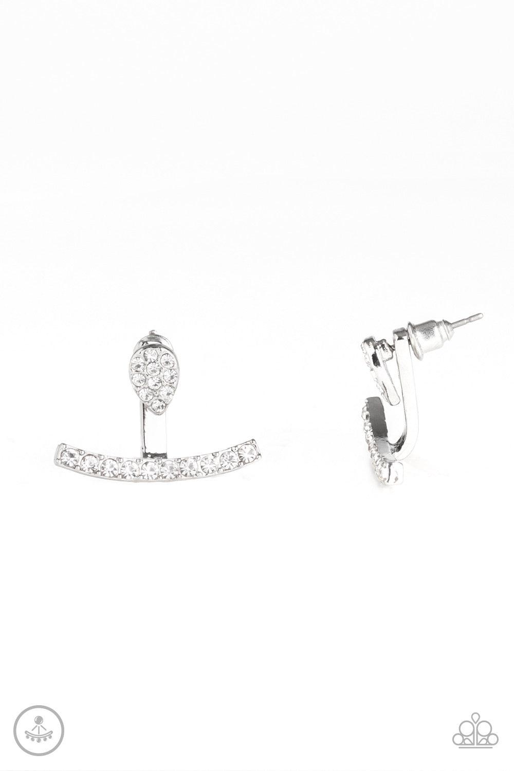 Paparazzi Accessories Glow Glimmer - White Encrusted in glassy white rhinestones, a dainty silver teardrop attaches to a double-sided post, designed to fasten behind the ear. Radiating with a row of glassy white rhinestones, a bowing silver frame peeks ou