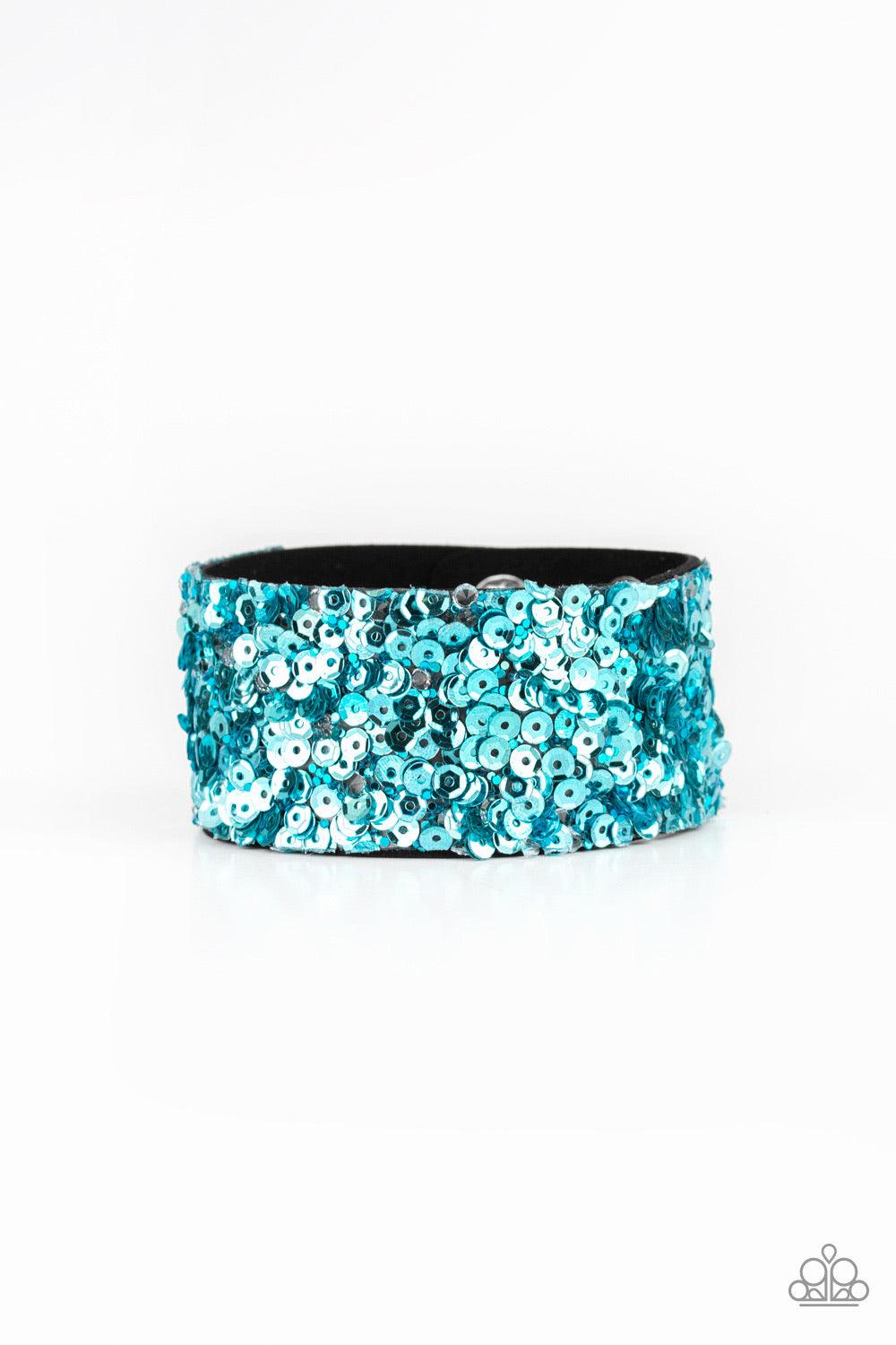 Paparazzi Accessories Starry Sequins - Blue A collision of glittery rhinestones and sparkling blue sequins are encrusted along the front of a black suede band, creating blinding shimmer around the wrist. Features an adjustable snap closure. Jewelry