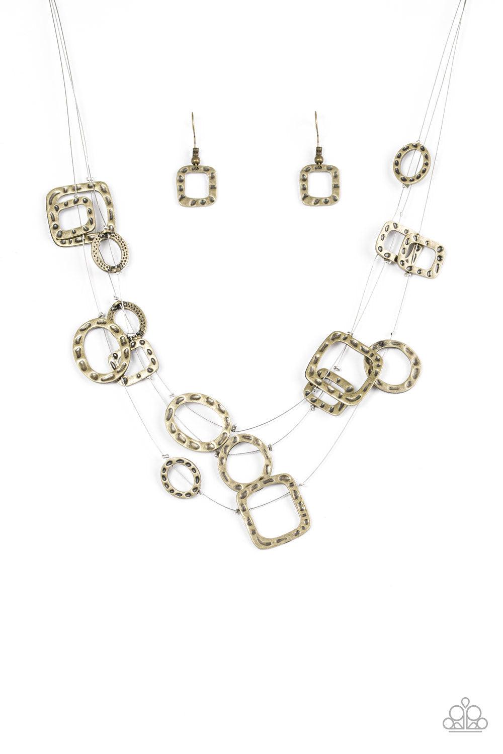 Paparazzi Accessories GEO-ing Strong - Brass Delicately hammered in an antiqued shimmer, round and square brass frames are secured in place along three glistening wires. The floating frames drape below the collar in a whimsical fashion. Features an adjust