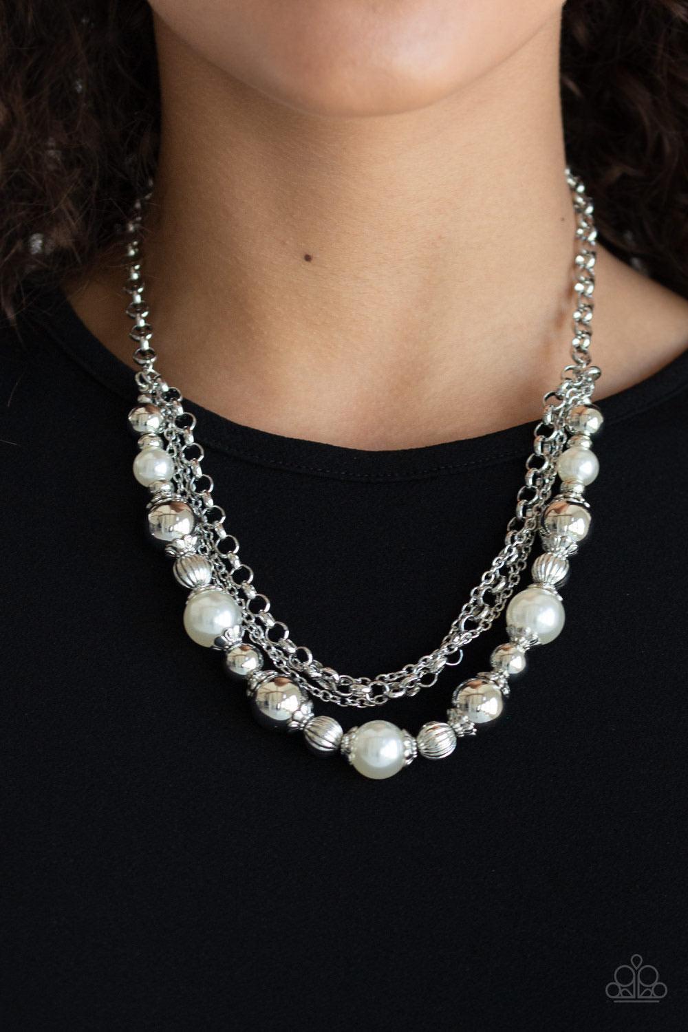 Paparazzi Accessories 5th Avenue Romance - White Layers of mismatched silver chains give way to a strand of ornate silver beads and oversized white pearls that cascade below the collar for a refined flair. Features an adjustable clasp closure. Sold as one