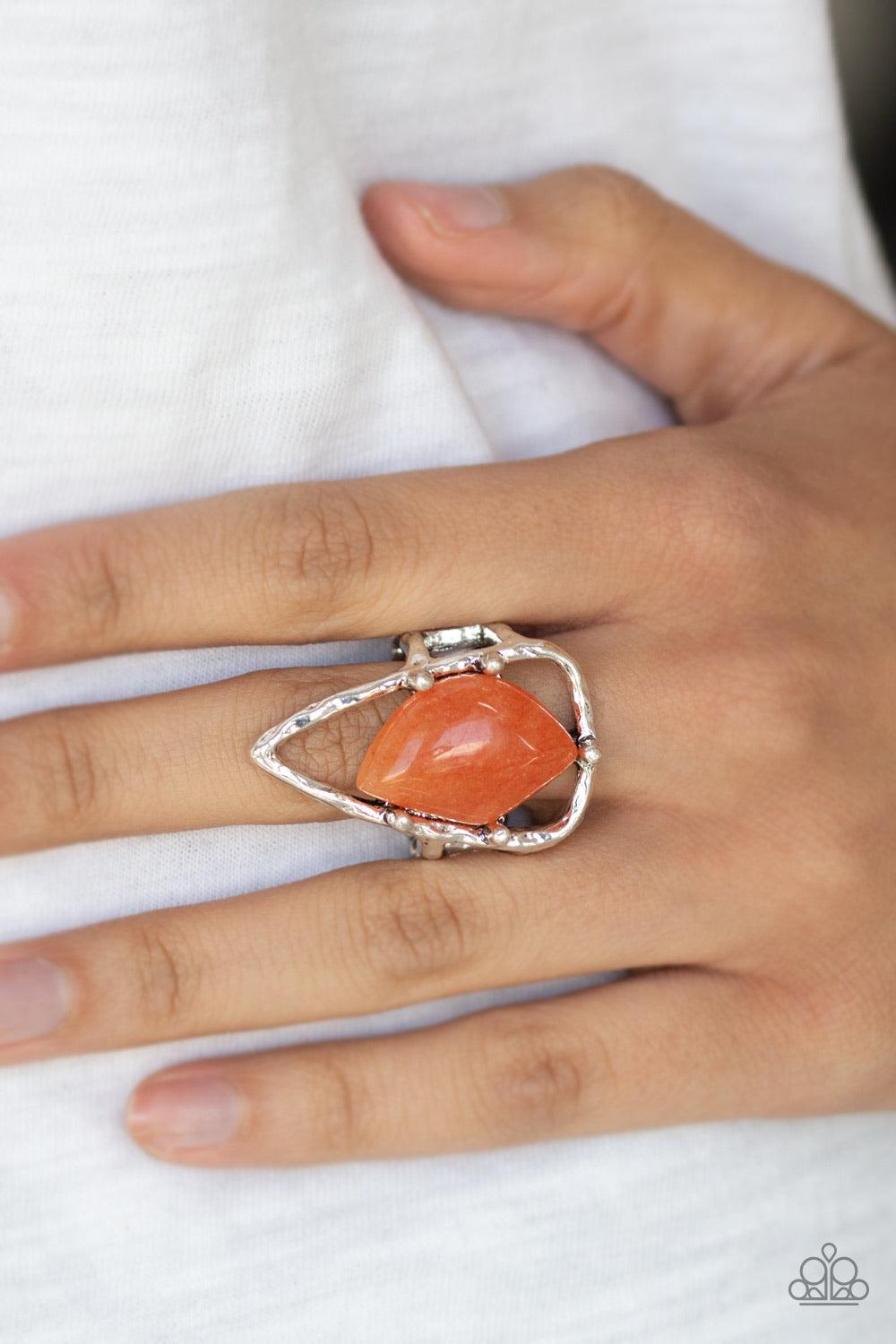 Paparazzi Accessories Get The Point ~Orange An abstract orange stone is nestled inside a hammered silver triangle, creating an artisan inspired frame atop the finger. Features a stretchy band for a flexible fit.