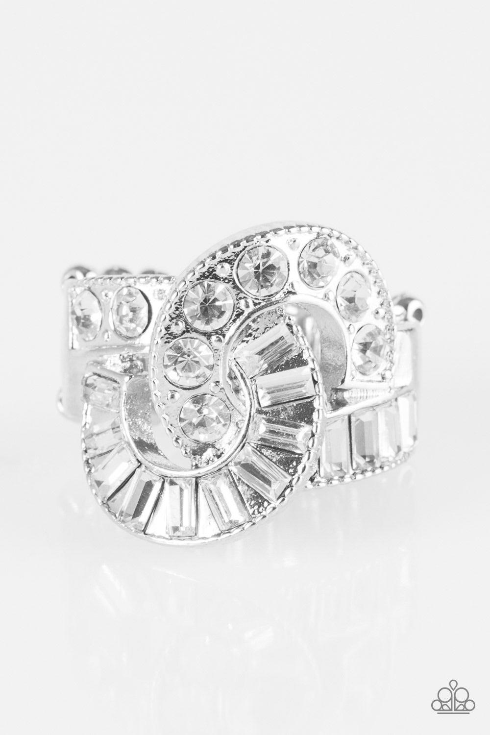 Paparazzi Accessories The Victor - White Featuring classic round and emerald style cuts, glittery white rhinestones are sprinkled along interwoven silver ribbons for the ultimate sparkle. Features a stretchy band for a flexible fit. Jewelry