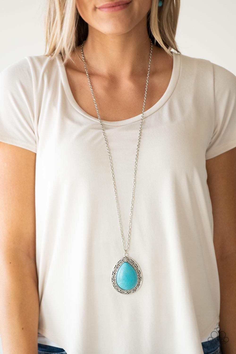 Paparazzi Accessories Full Frontier - Blue A refreshing turquoise stone teardrop is pressed into the center of an ornate silver frame, creating a dramatic pendant for a seasonal look. Features an adjustable clasp closure. Jewelry