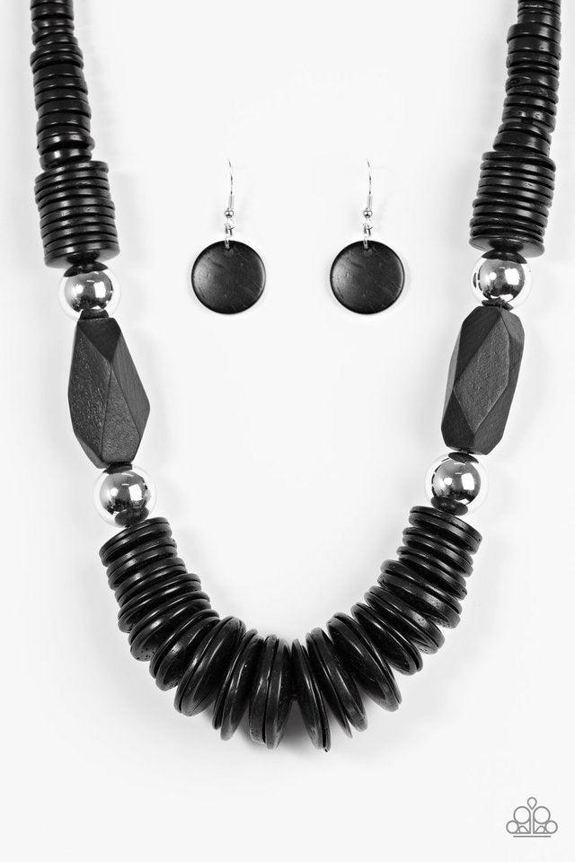 Paparazzi Accessories Boldly Belize - Black Brushed in a shiny black finish, round wooden discs are threaded along shiny brown cording, stacking below the collar for a seasonal look. Dramatic silver beads and faceted wooden accents join the earthy palette