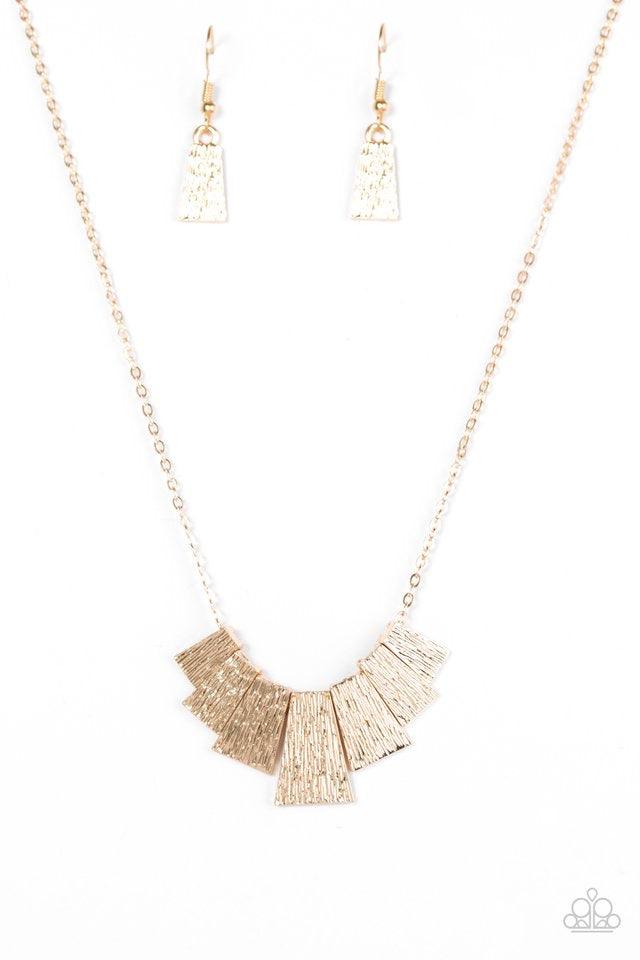 Paparazzi Accessories Cry Wolf - Gold Etched in shimmery serrated textures, flared gold plates trickle below the collar in a tribal inspired fashion. Features an adjustable clasp closure. Sold as one individual necklace. Includes one pair of matching earr