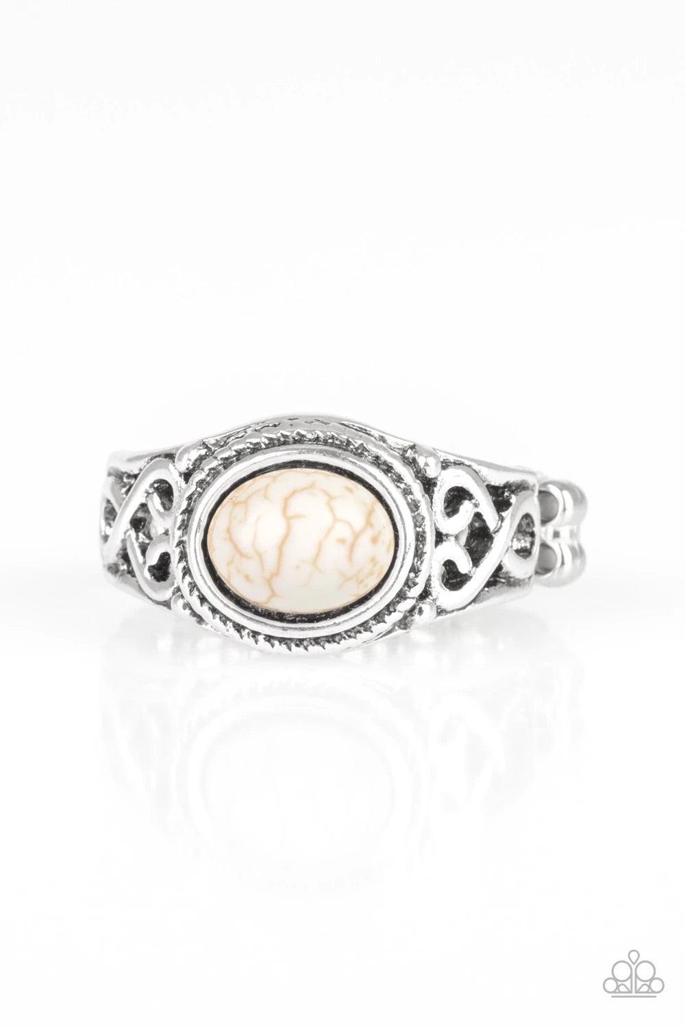 Paparazzi Accessories Set In Stone - White A refreshing white stone is pressed into the center of a dainty silver band radiating with studded and filigree textures for a seasonal look. Features a dainty stretchy band for a flexible fit. Sold as one indivi