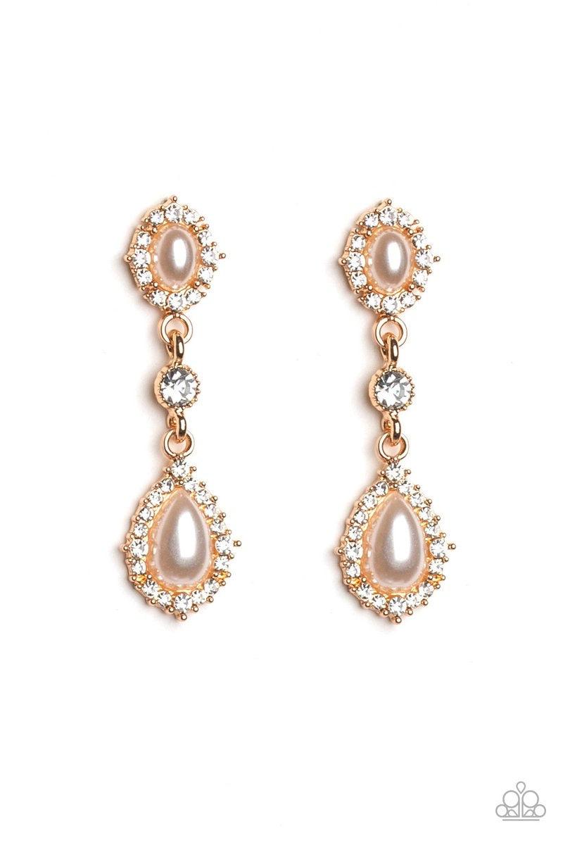 Paparazzi Accessories All-GLOWING - Gold A solitaire white rhinestone is linked between two pearly and white rhinestone encrusted frames, creating an elegant lure. Earring attaches to a standard post fitting. Jewelry