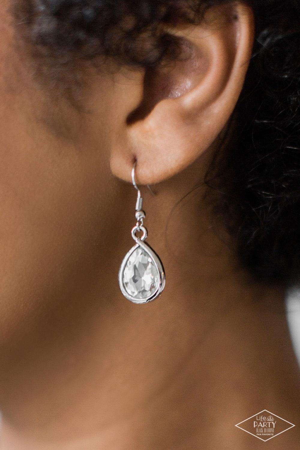 Paparazzi Accessories Love At FIERCE Sight - White Suspended by glittery links, large teardrop gems drip below the collar, creating a dramatic fringe. Swooping silver bars spin around the faceted teardrops, adding a shiny metallic finish to the fierce cen