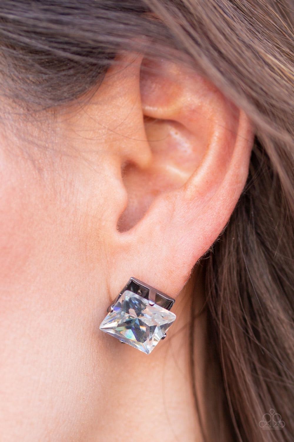 Paparazzi Accessories Prima Donna Drama - Black Featuring a regal princess style cut, an oversized white gem sits atop a classic gunmetal frame in a dramatic finish. Earring attaches to a standard post fitting. Jewelry