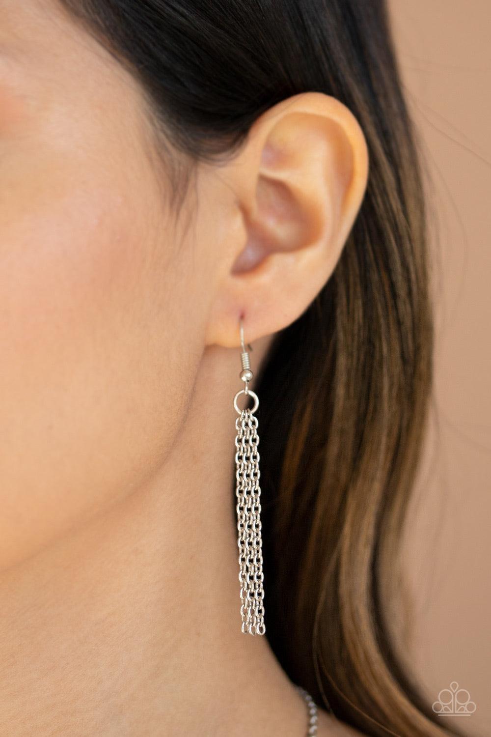 Paparazzi Accessories Imperfect Iridescent - Yellow An imperfect yellow gem is pressed into the center of an edgy silver frame at the bottom of a lengthened silver chain for a glitzy look. Features an adjustable clasp closure. Sold as one individual neckl